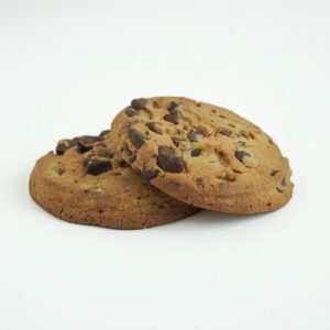 Two Delicious Chocolate Chip Cookies Stacked on a White Background